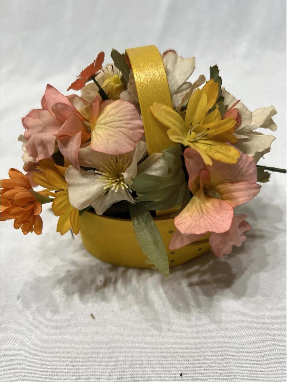 Shaker-style oval basket with artificial flowers